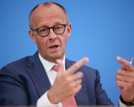 German chancellor Friedrich Merz gestures as he speaks during his annual summer press conference in Berlin.