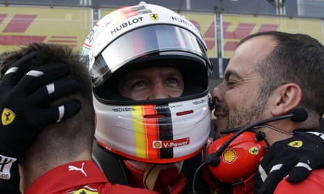 Ferrari driver Sebastian Vettel celebrates after clocking the fastest time in qualifying