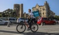 A man rides a rental bike in Baku, Azerbaijan, where the UN climate change conference will convene in November.