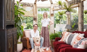 Charlie and Justin Salisbury in their refitted conservatory with their dog, Bob.