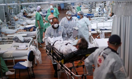 A patient suffering from the coronavirus disease (COVID-19) is transported at a field hospital set up at Dell’Antonia sports gym in Santo Andre, on the outskirts of Sao Paulo, Brazil.