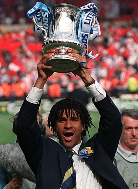 Chelsea manager, Ruud Gullit, holds the FA Cup aloft after his team won the 1997 final at Wembley 2-0 against Middlesbrough.