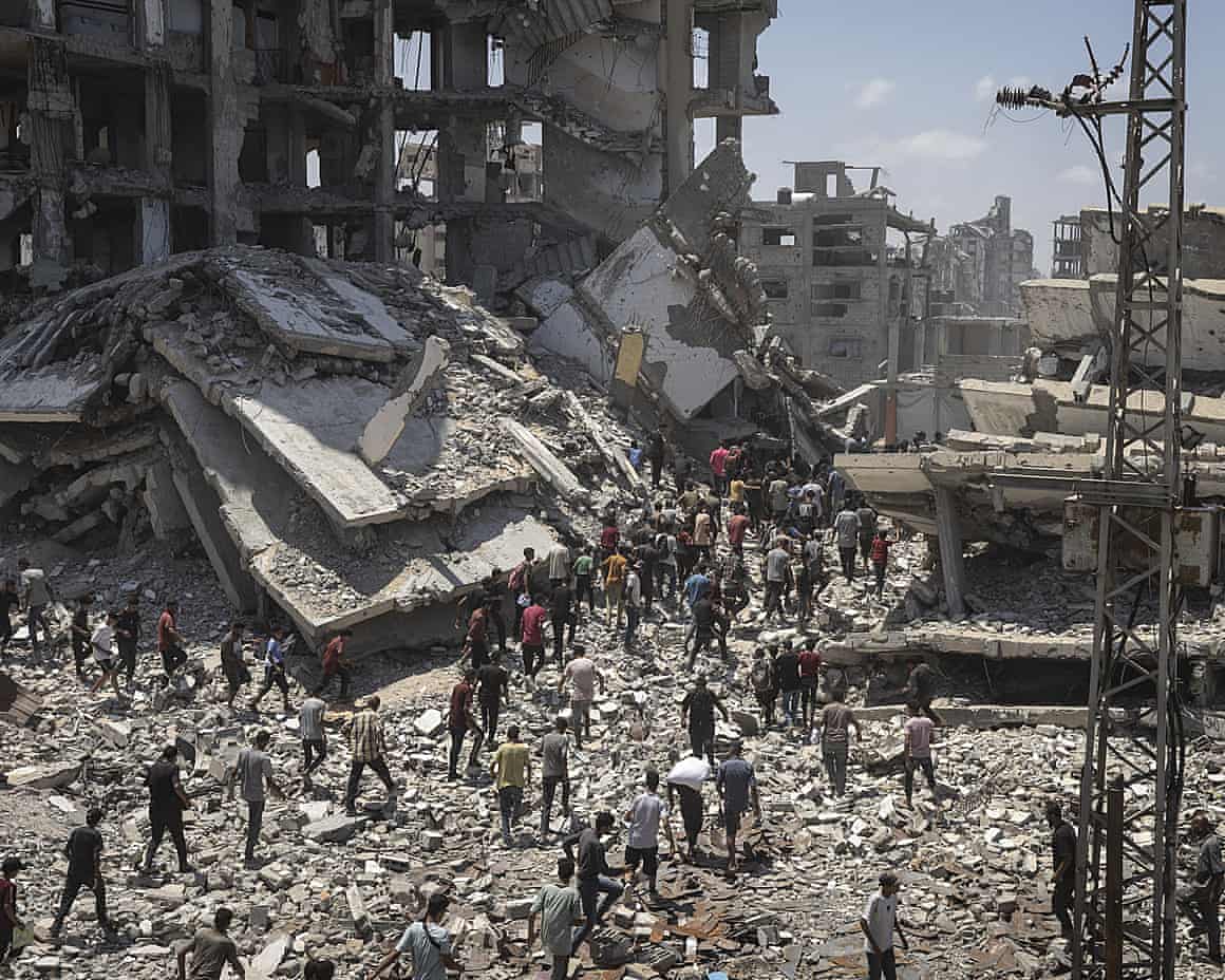 People in the ruins of Gaza City