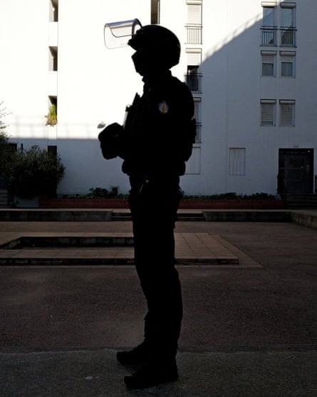 An officer during a police operation in Les Moulins neighbourhood.