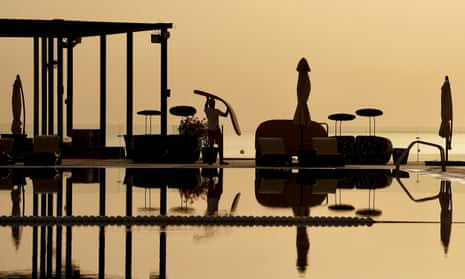 A pool attendant (not interviewed for this story) working at a luxury hotel near Doha, Qatar.