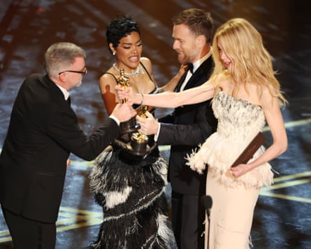 group of four people on stage