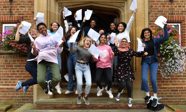 Pupils celebrate with their GCSE results at King Edward VI high school for girls, in Birmingham.