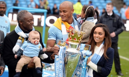 Two’s Kompany: Pierre Kompany with his son Vincent with the Premier League trophy in May 2014