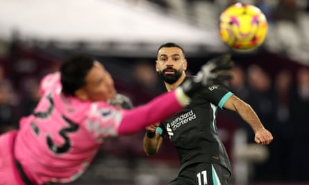 *** BESTPIX *** TOPSHOT-FBL-ENG-PR-WEST HAM-LIVERPOOL<br>TOPSHOT - Liverpool's Egyptian striker #11 Mohamed Salah looks on as West Ham United's French goalkeeper #23 Alphonse Areola saves his shot during the English Premier League football match between West Ham United and Liverpool at the London Stadium, in London on December 29, 2024. (Photo by Adrian Dennis / AFP) / RESTRICTED TO EDITORIAL USE. No use with unauthorized audio, video, data, fixture lists, club/league logos or 'live' services. Online in-match use limited to 120 images. An additional 40 images may be used in extra time. No video emulation. Social media in-match use limited to 120 images. An additional 40 images may be used in extra time. No use in betting publications, games or single club/league/player publications. / (Photo by ADRIAN DENNIS/AFP via Getty Images) *** BESTPIX ***