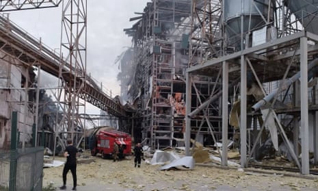 Rescuers work at the site of vegetable oil factory reportedly destroyed by a Russian missile strike, in Poltava region, Ukraine.