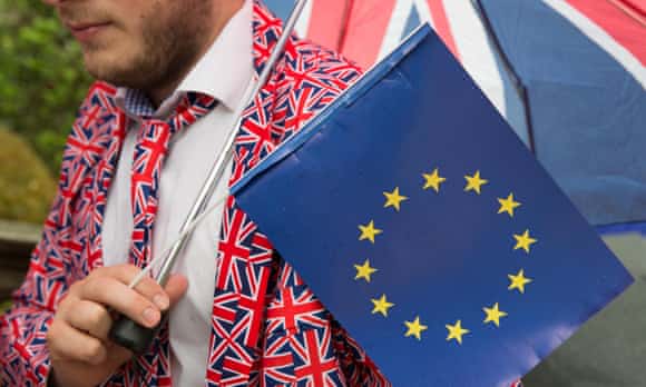 Moritz Blauth, from Germany, dressed in a Union Jack suit he found on eBay, holds an EU flag
