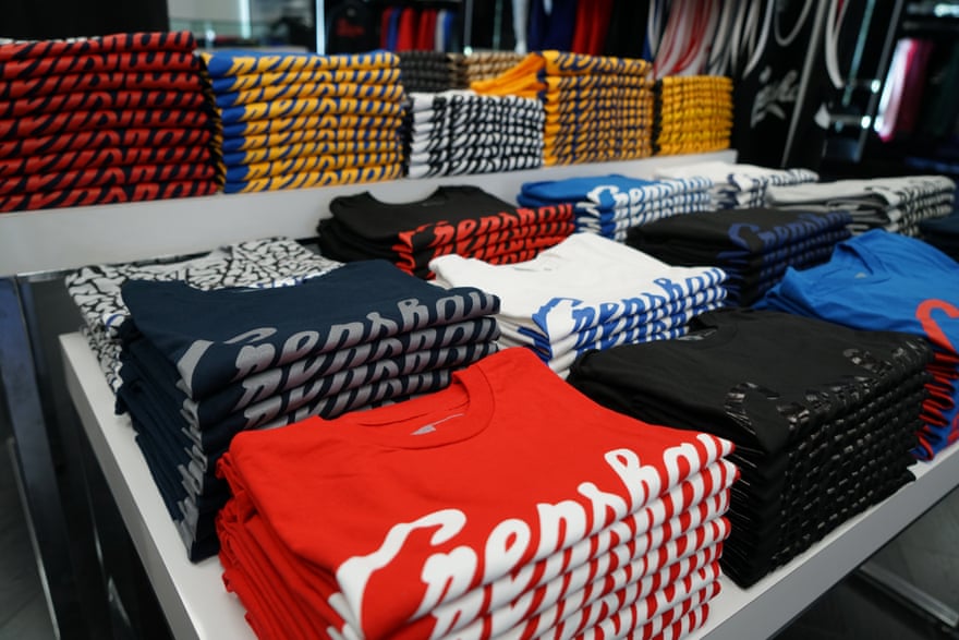 White tables in a clothing store display t-shirts with ‘Crenshaw’ written on them.