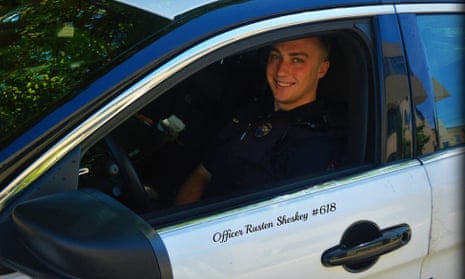 The Kenosha police officer Rusten Sheskey, 31, sits in his patrol car. Sheskey has now returned from administrative leave following the shooting of Jacob Blake.