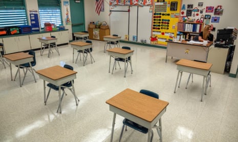 Desks are spaced out in a classroom in Miami, Florida. 
