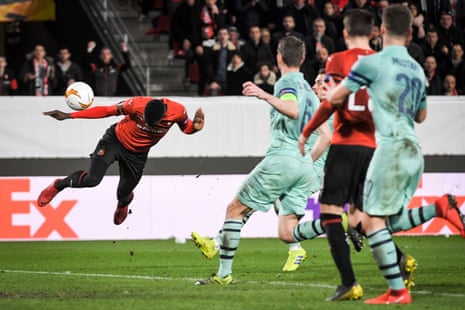 Rennes' Senegalese forward Ismaila Sarr (L) heads to score their third goal