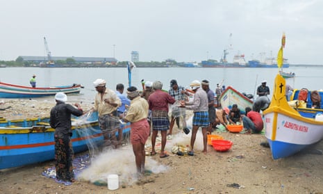 Indian fishermen sort their catch at Kollam beach in Kerala. Since 2017, about 80 tonnes of plastic has been collected from the sea there. 