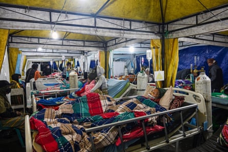 Earthquake victims are treated in a temporary medical tent
