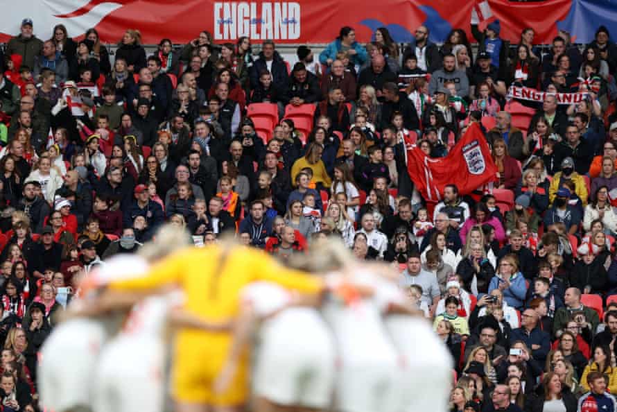 England fans at Wembley look on as England players huddle prior to the Women’s World Cup 2023 qualifier against Northern Ireland in October 2021