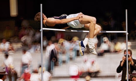 Dick Fosbury clears the bar in the high jump competition at the 1968 Mexico City Olympics. He went on to win gold for the US in the event.