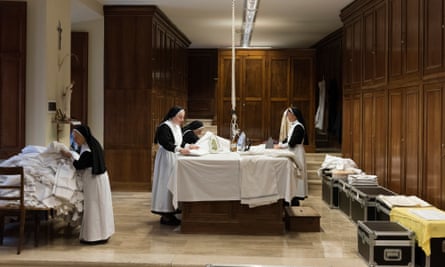 Nuns at work ironing.
