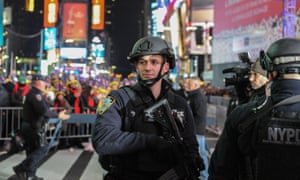 A member of the counter terrorism task force stands guard in Times Square.