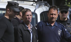 Seif Eddin Mustafa is escorted by Cypriot police after a court hearing.