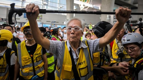 Uncle Wong, 82: protecting Hong Kong protesters with his walking stick – video 