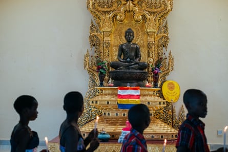 A statue of Mirembe, which means ‘peace’ in Luganda, watches over followers. The statue was made from metal offered by Thai people. 