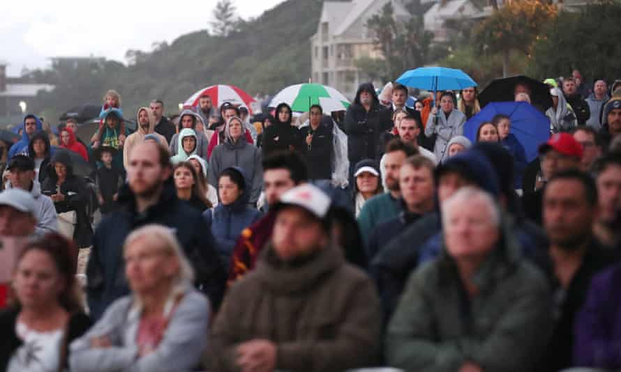 People attend the dawn service at Currumbin, during Anzac Day in Gold Coast, Australia, 25 April 2022. EPA/JONO SEARLE