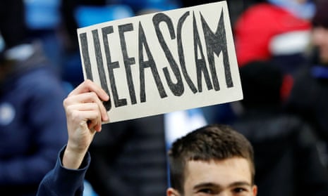 A Manchester City fan holds up a sign before the match against West Ham. 