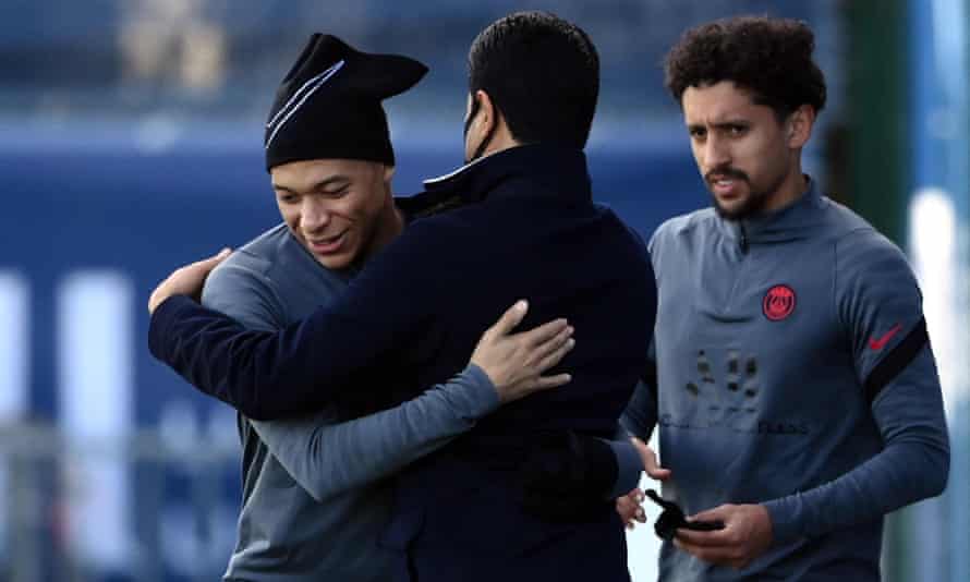 Kylian Mbappé gets a hug from PSG’s president Nasser al-Khelaifi on the eve of the game against Real Madrid.