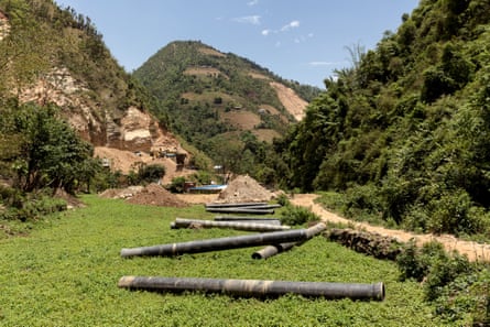 Steel pipeline lies stockpiled in a farmer’s field in Kushadevi, Nepal