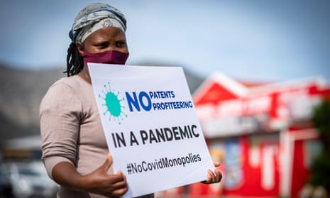 A woman takes part in a protest calling for big pharma to drop patents and other intellectual property protections to ensure there is equitable access to Covid vaccines.