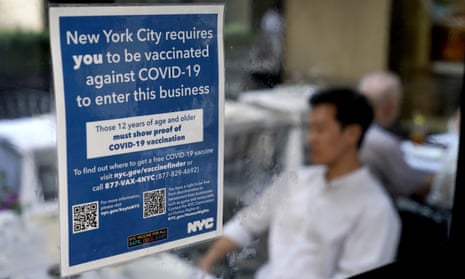 A notice explaining that proof of vaccination is required to dine inside is seen at a restaurant in midtown Manhattan.