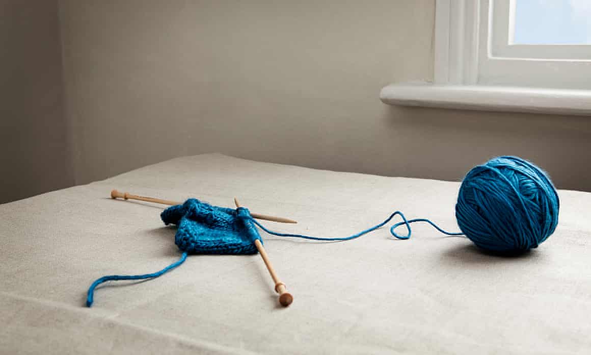 A ball of wool and knitting needles