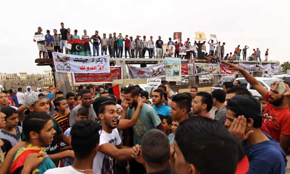 Libyans take part in a protest against a national unity government proposal by United Nations envoy Bernardino Leon, in Benghazi on 16 October.