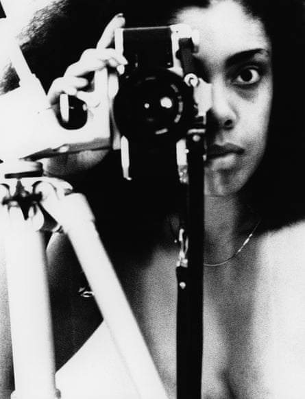 a woman holding a camera