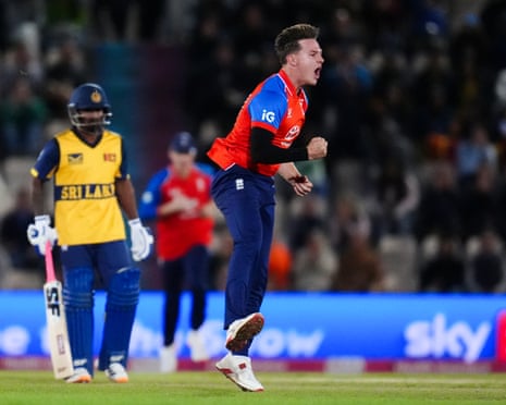 England's Sonny Baker celebrates a wicket, fist clenched, as a Sri Lankan batsman looks on