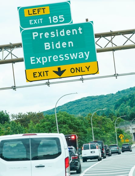 Joe Biden’s presidential motorcade passes a sign for the President Biden Expressway in Scranton on 17 August 2023.