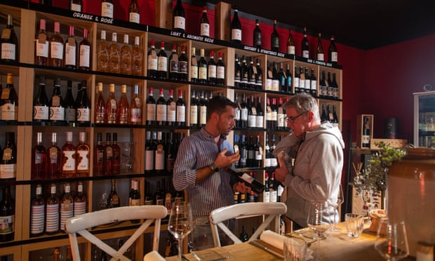 Arcade Wine's Danilo Duseli assists a customer.