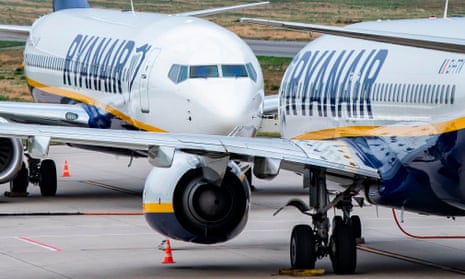 Two Ryanair planes on the tarmac of an airport