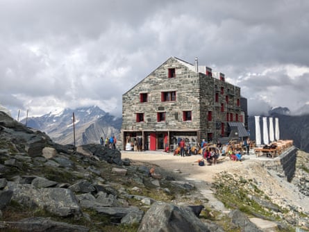 Large stone building in mountains.
