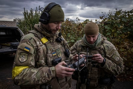 Max (left) and Ivan use a drone.