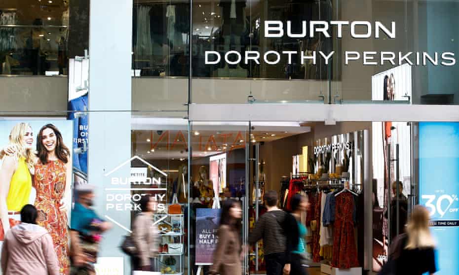 People walk past a Burton and Dorothy Perkins store