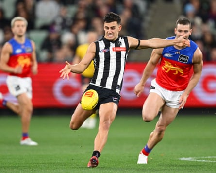 Nick Daicos kicks the ball while playing for Collingwood
