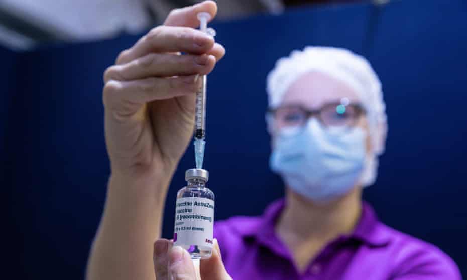 A Perth nurse fills a syringe with AstraZeneca vaccine
