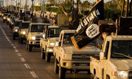 Islamic State (Isis) fighters parade in Sirte, Libya, in early 2015: the group is reportedly growing in strength as jihadists relocate from Syria. 