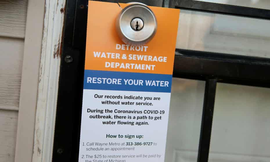 A notice by the Detroit water and sewerage department hangs on a house doorknob to inform residents how to restore service in response to the coronavirus outbreak, in March.