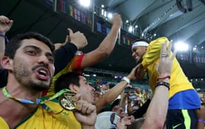 Neymar climbs into the stands as his team-mates show off their medals