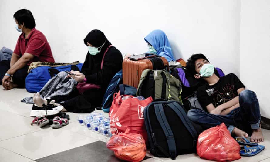 COVID-19 situation in Jakarta, Indonesia - 28 Jun 2021Mandatory Credit: Photo by Risa Krisadhi/SOPA Images/REX/Shutterstock (12189233j) Patients with Covid-19 queue to be served by health workers inside the Wisma Atlet Covid-19 Emergency Hospital complex. Indonesia has seen a significant spike in COVID-19 cases, recording an average of more than 21,000 cases per day putting pressure on hospitals, including in Jakarta and its surroundings, where most hospital beds are full. COVID-19 situation in Jakarta, Indonesia - 28 Jun 2021